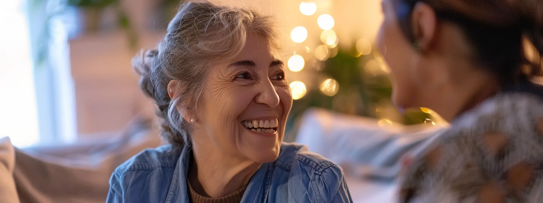 a smiling, compassionate personal care aide providing tailored support to a grateful elderly individual in the comfort of their home.